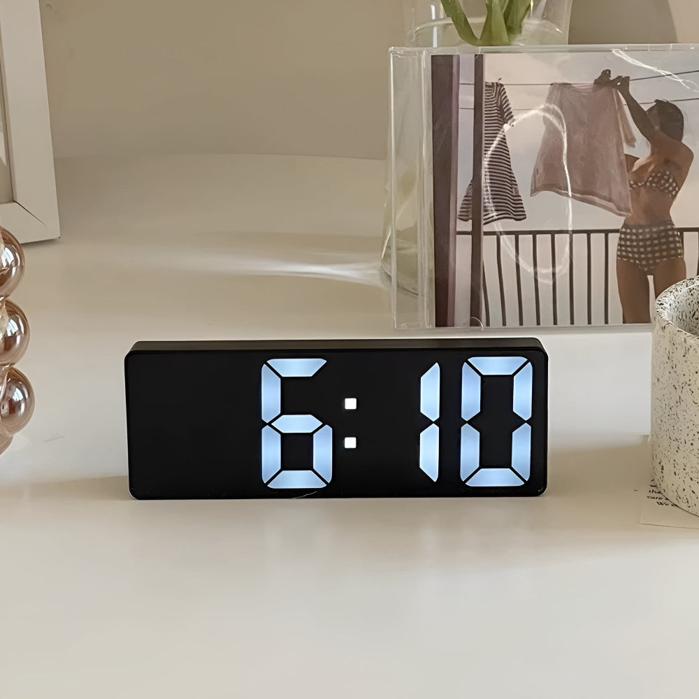Modern LED digital alarm clock in black and white with large display, 12/24 hour format and night light feature