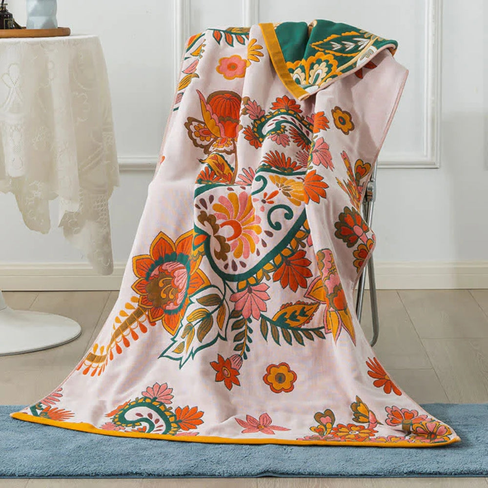 Floral throw blanket with pink background and colorful bohemian flower design, soft decorative sofa and bed cover
