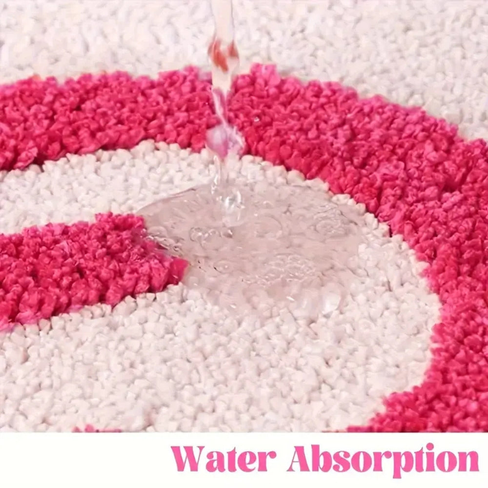 Pink bath mat with bold red ‘Get Naked’ lettering, soft absorbent funny bathroom rug for modern decor