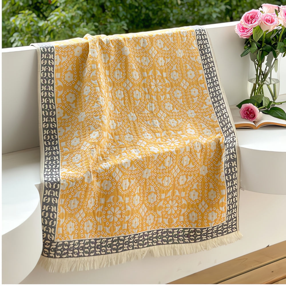 Soft throw blanket with Van Gogh inspired starry night design in blue and yellow, with fringe edges