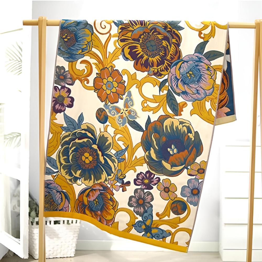 Floral throw blanket with cream background and bold blue yellow flower pattern, soft decorative sofa and bed cover