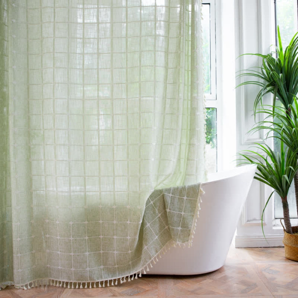 Light green sheer shower curtain with grid pattern and tassel trim, waterproof bathroom curtain for modern home decor