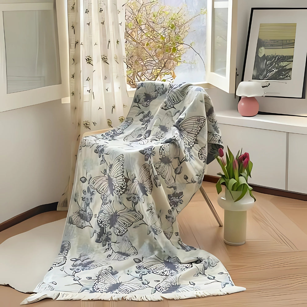 Soft throw blanket with Van Gogh inspired starry night design in blue and yellow, with fringe edges