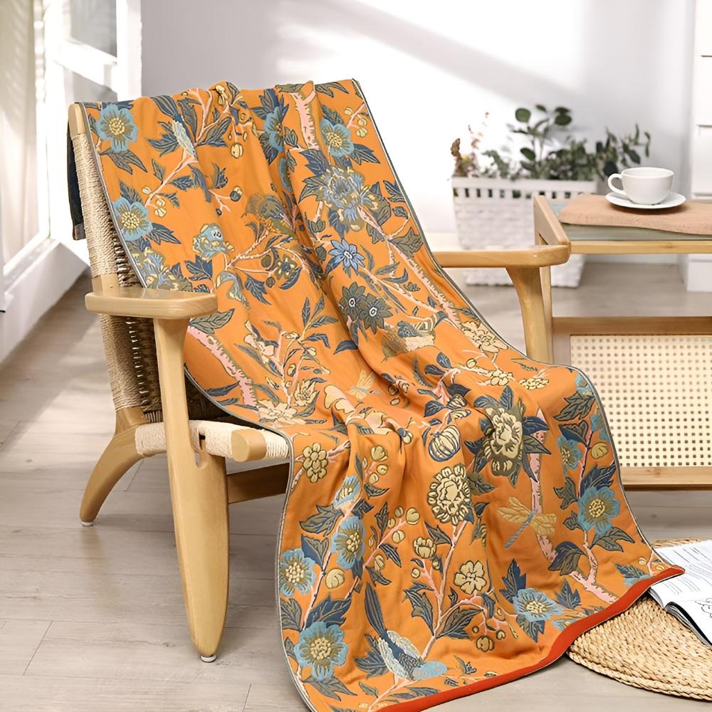 Floral throw blanket with orange background and blue yellow flower design, soft decorative sofa and bed cover