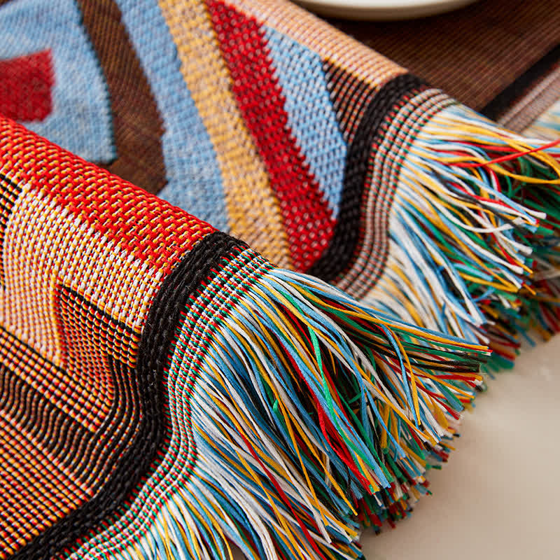 Geometric sofa cover with tassels