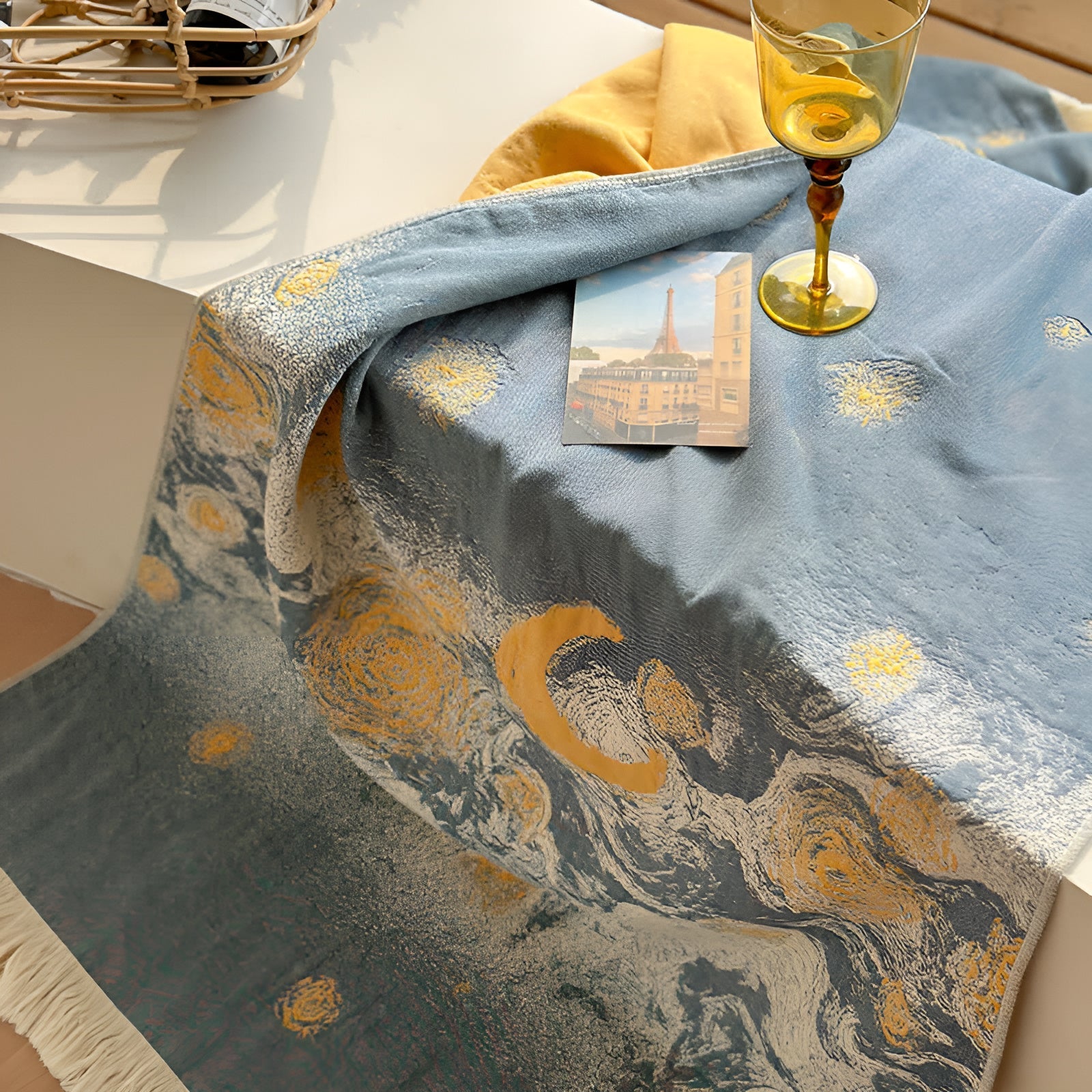 Soft throw blanket with Van Gogh inspired starry night design in blue and yellow, with fringe edges