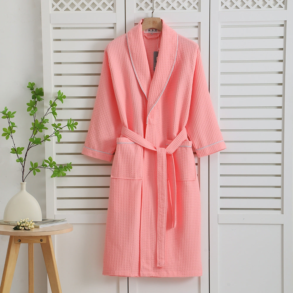 Pink waffle bathrobe with shawl collar, front pockets, and waist belt – lightweight cotton robe for women