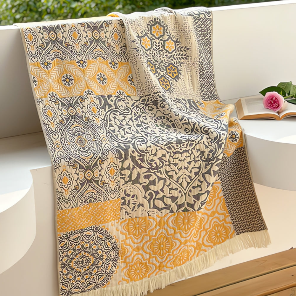 Soft throw blanket with Van Gogh inspired starry night design in blue and yellow, with fringe edges