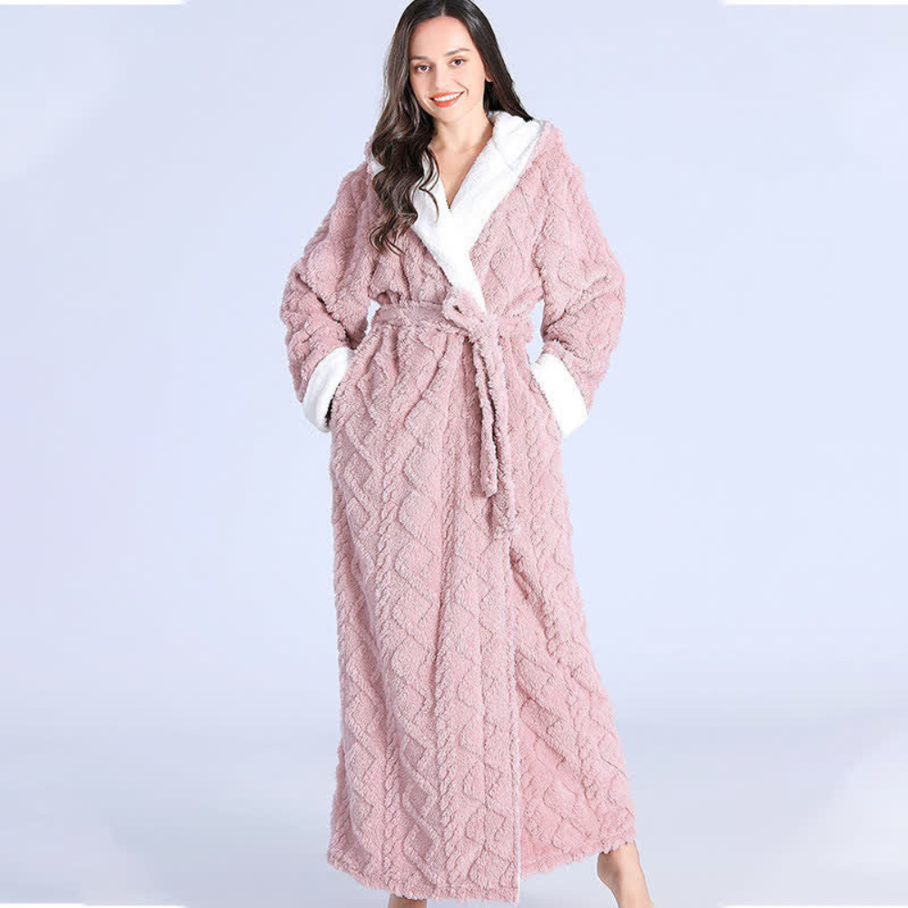 Women's long purple fleece bathrobe with hood, white trim, and textured chevron pattern, cozy winter loungewear