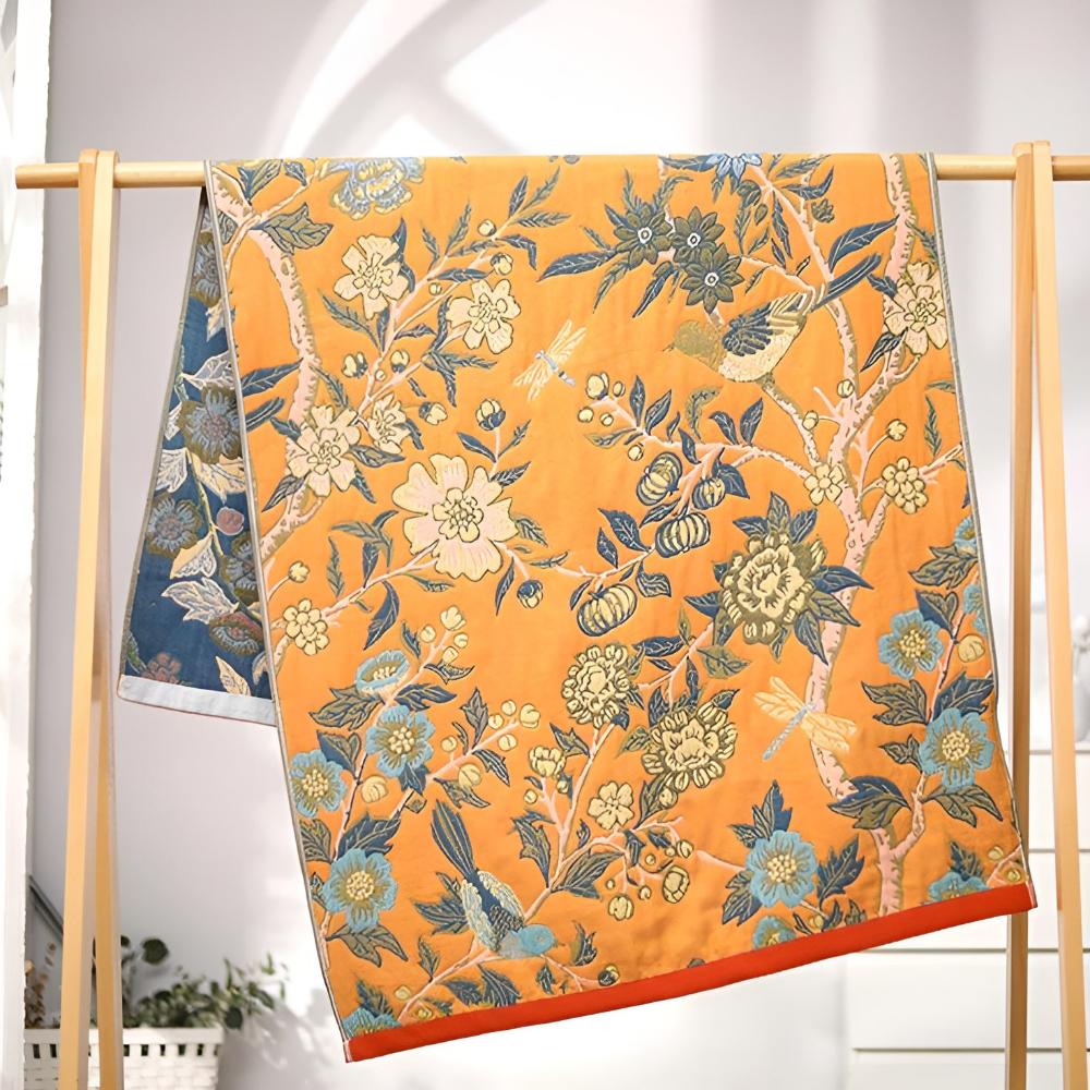 Floral throw blanket with orange background and blue yellow flower design, soft decorative sofa and bed cover