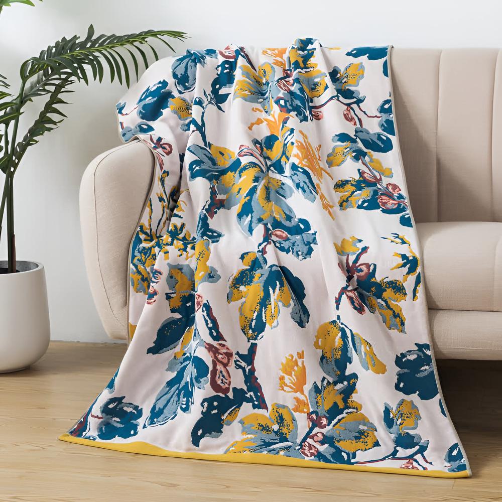Soft decorative throw blanket with bold yellow and blue floral leaf print, lightweight cozy sofa couch cover