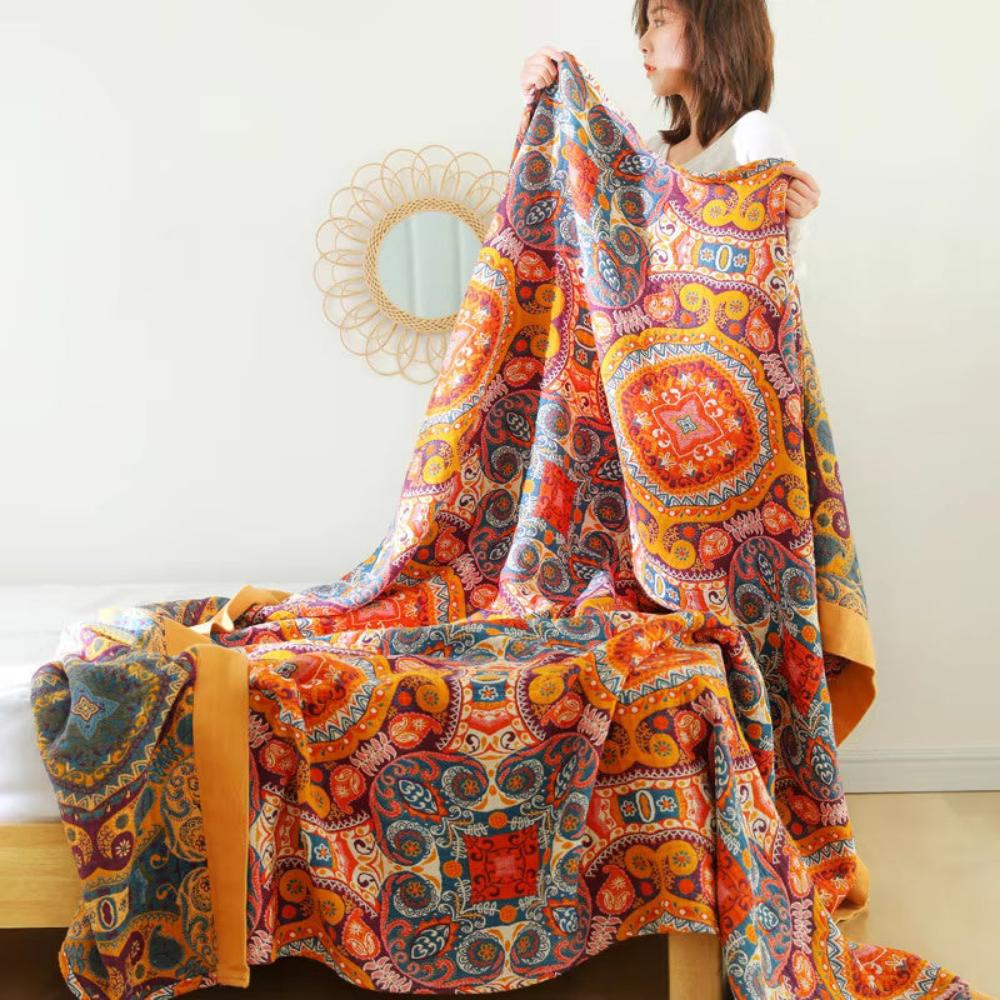 Bohemian patchwork quilt blanket with vibrant mandala and paisley patterns in orange, red, and blue – lightweight bedspread or throw