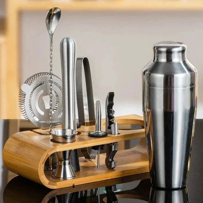 Premium stainless steel cocktail shaker set with mixing spoon, citrus slices, and bar tools – professional bartender kit for home and party drinks