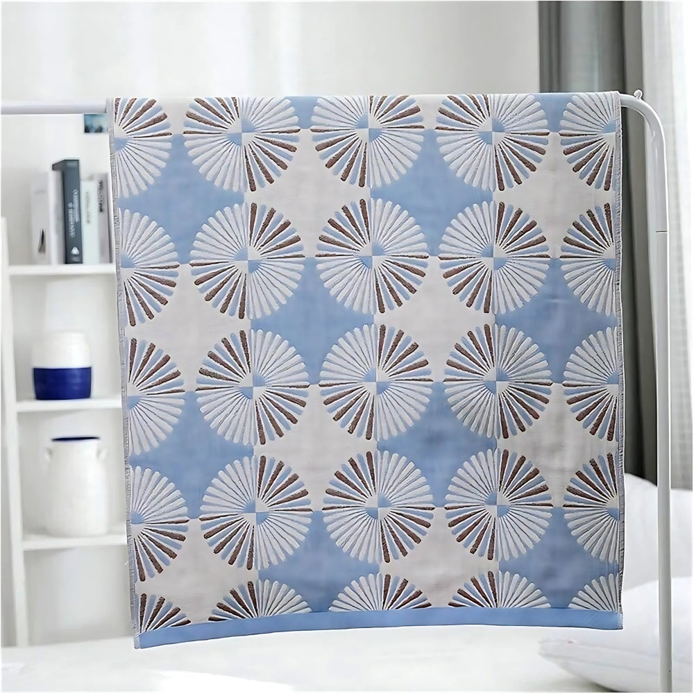 Light green and white throw blanket with modern fan circle pattern, soft decorative accent for sofa or bed