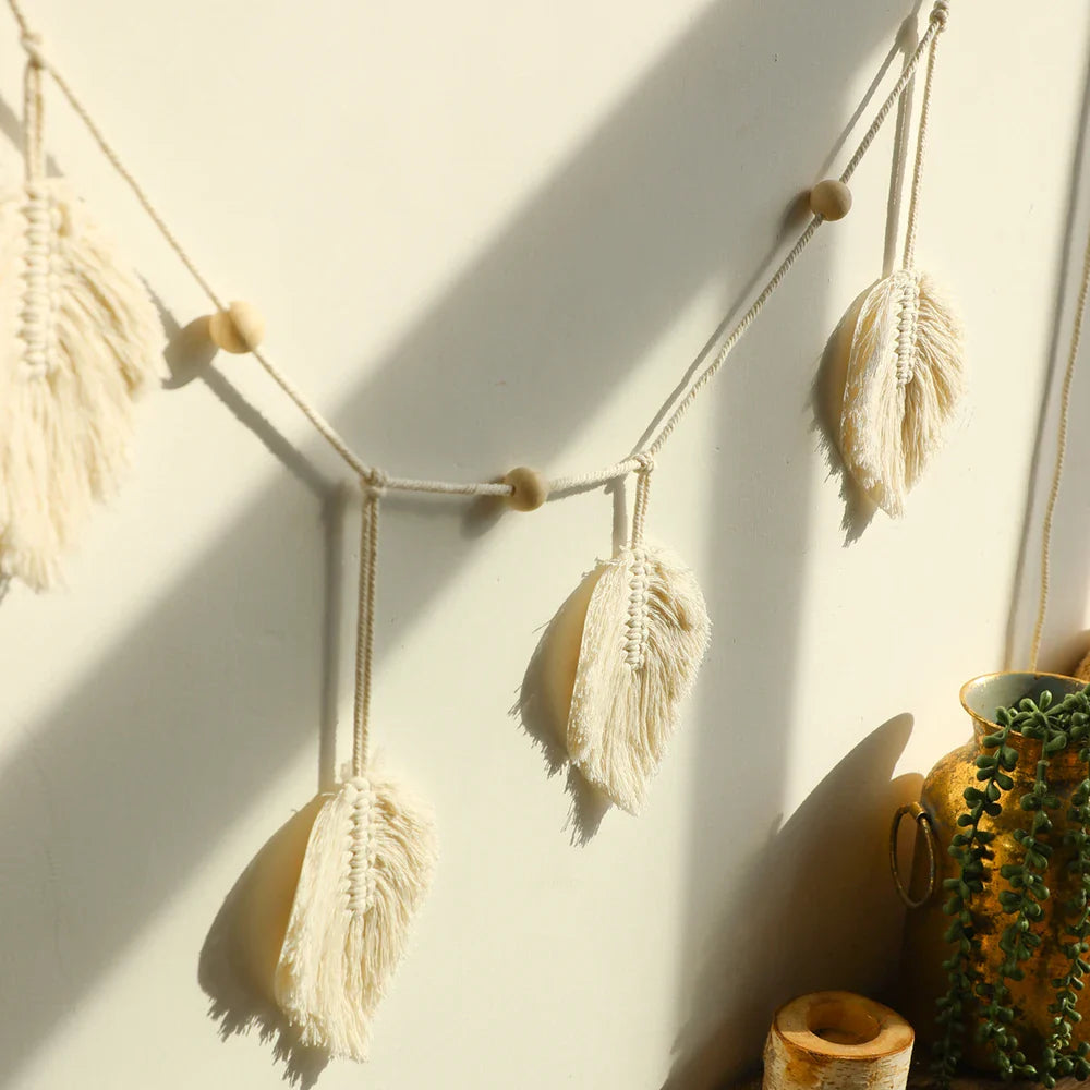 Handmade macrame leaf garland wall hanging with natural cotton rope and wooden beads for boho home decor