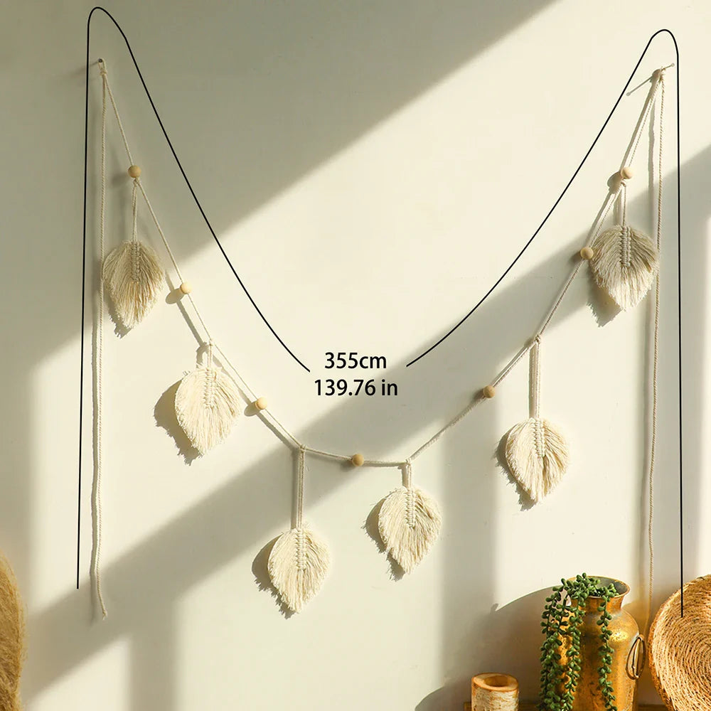 Handmade macrame leaf garland wall hanging with natural cotton rope and wooden beads for boho home decor