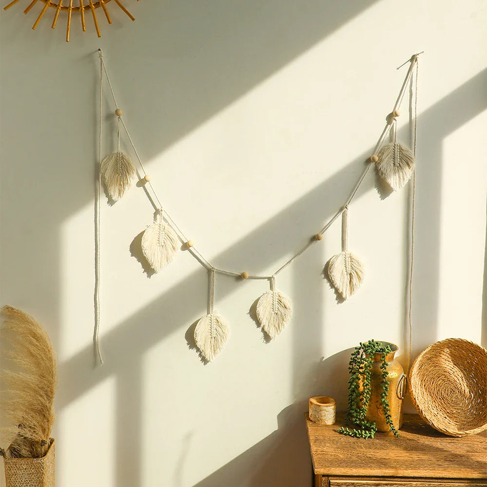 Handmade macrame leaf garland wall hanging with natural cotton rope and wooden beads for boho home decor