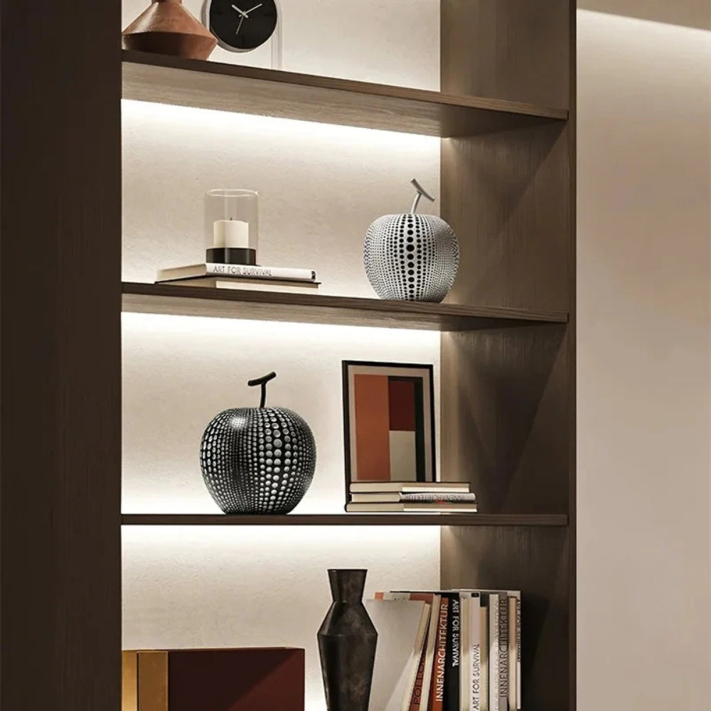 Modern black and white apple sculpture decor with polka dot design, contemporary resin ornaments for living room or office display