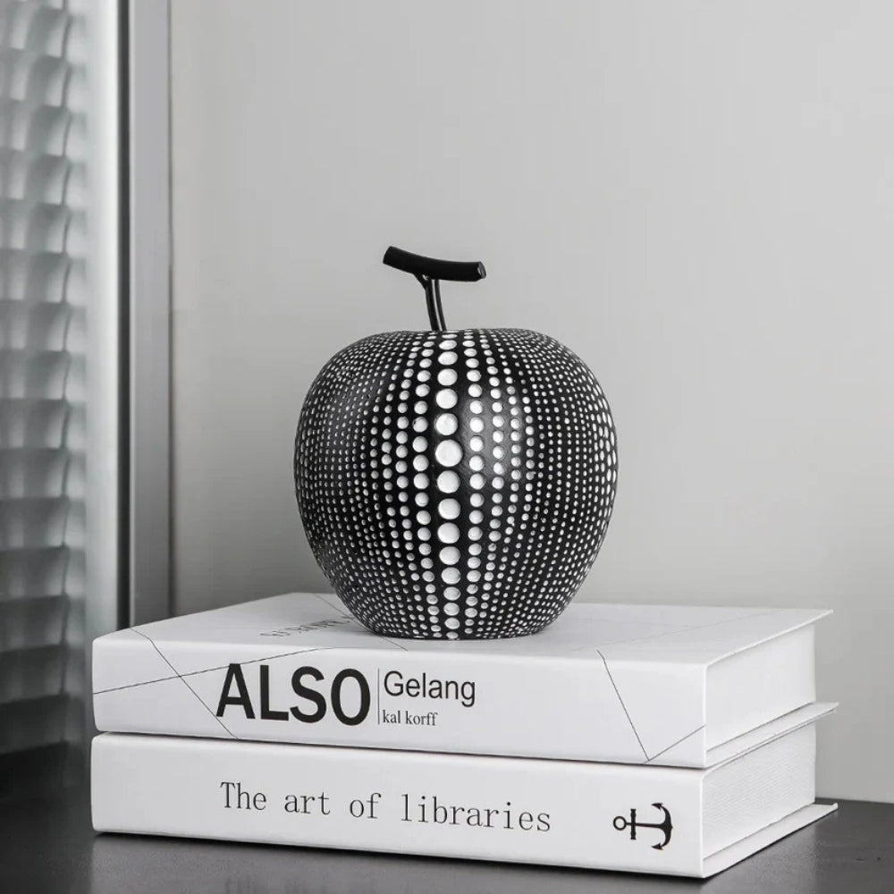 Modern black and white apple sculpture decor with polka dot design, contemporary resin ornaments for living room or office display