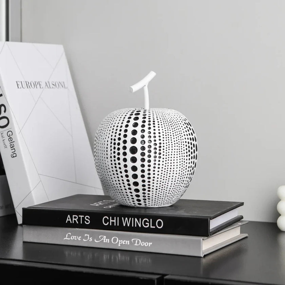 Modern black and white apple sculpture decor with polka dot design, contemporary resin ornaments for living room or office display
