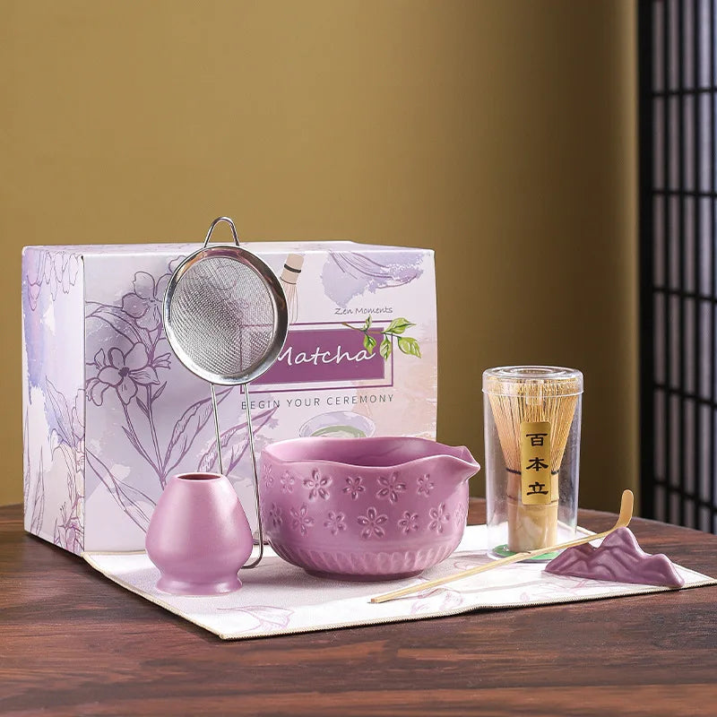 Japanese matcha tea whisk with purple cherry blossom bowl, traditional bamboo chasen for green tea ceremony