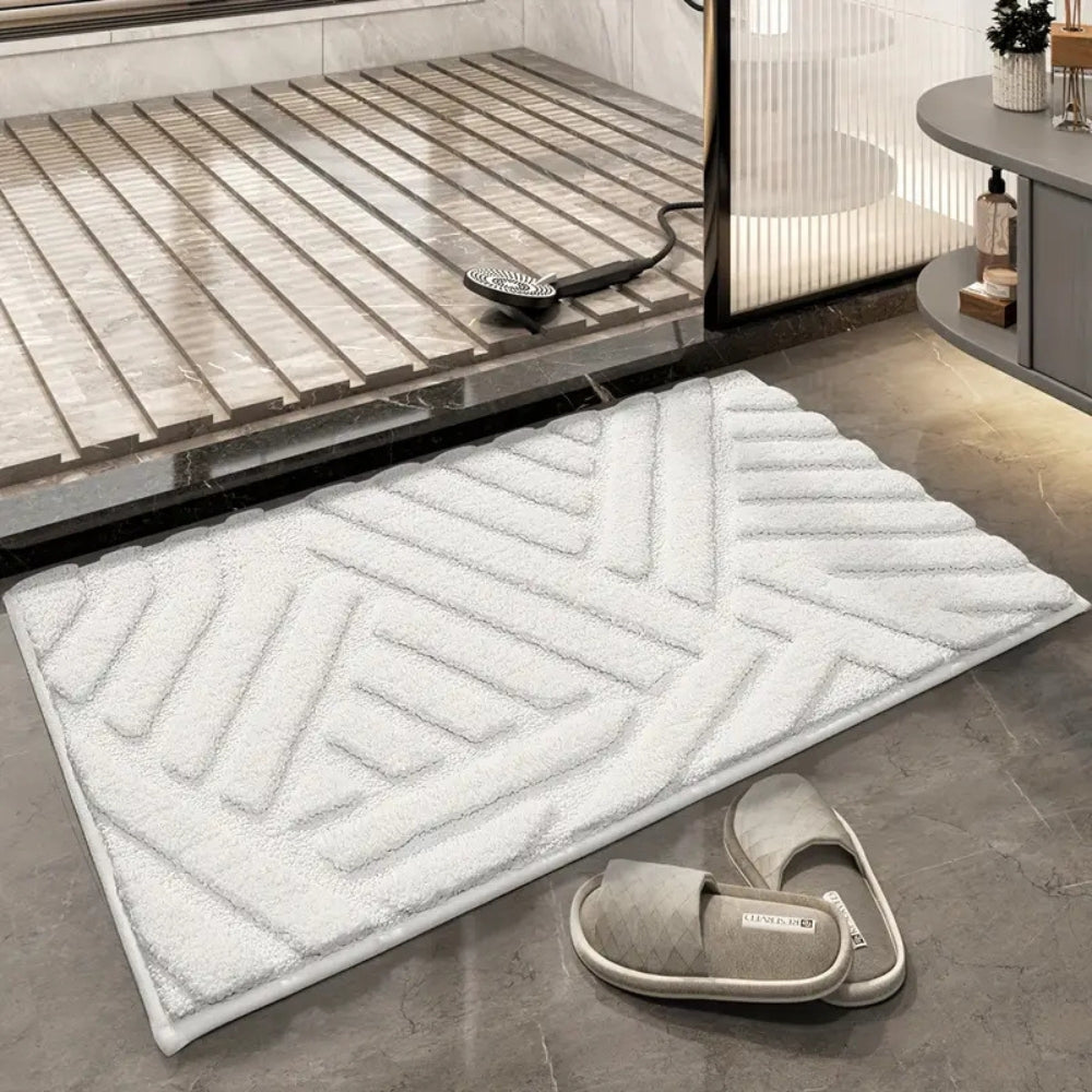 Anti-slip white bathroom rug with modern geometric embossed pattern, soft absorbent bath mat for bathroom and shower area