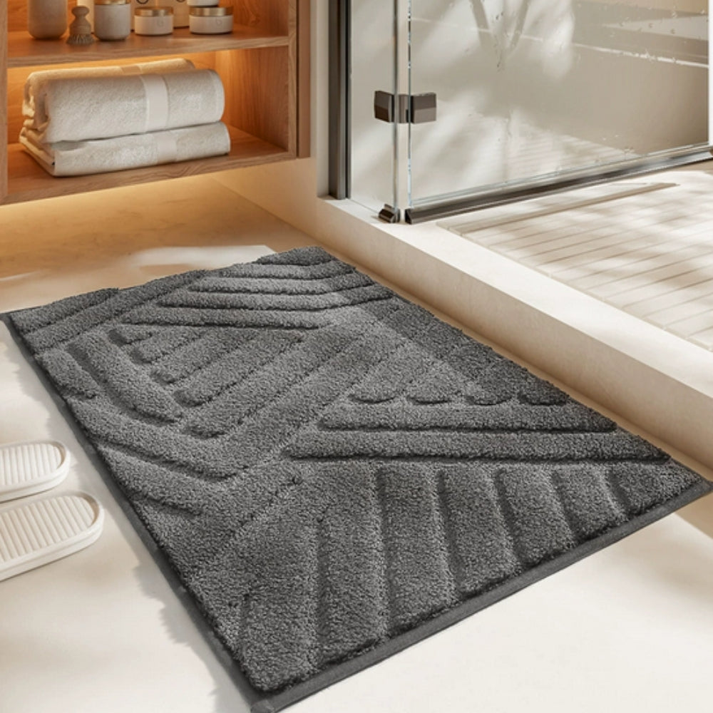 Anti-slip white bathroom rug with modern geometric embossed pattern, soft absorbent bath mat for bathroom and shower area