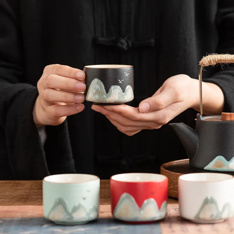 Set of four ceramic Chinese tea cups with hand-painted mountain design, gift box for traditional gongfu tea ceremony