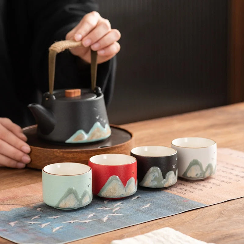 Set of four ceramic Chinese tea cups with hand-painted mountain design, gift box for traditional gongfu tea ceremony