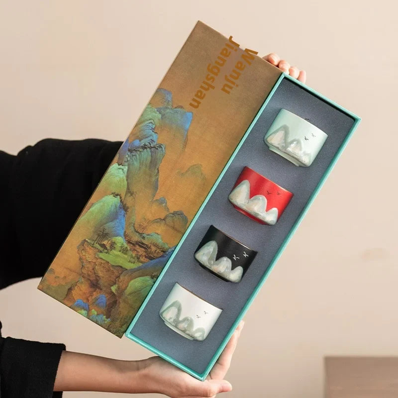 Set of four ceramic Chinese tea cups with hand-painted mountain design, gift box for traditional gongfu tea ceremony