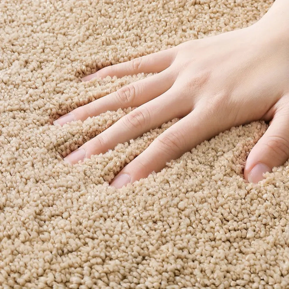 Beige oval bathroom rug, soft absorbent bath mat with non-slip backing, plush microfiber floor rug for tub or shower