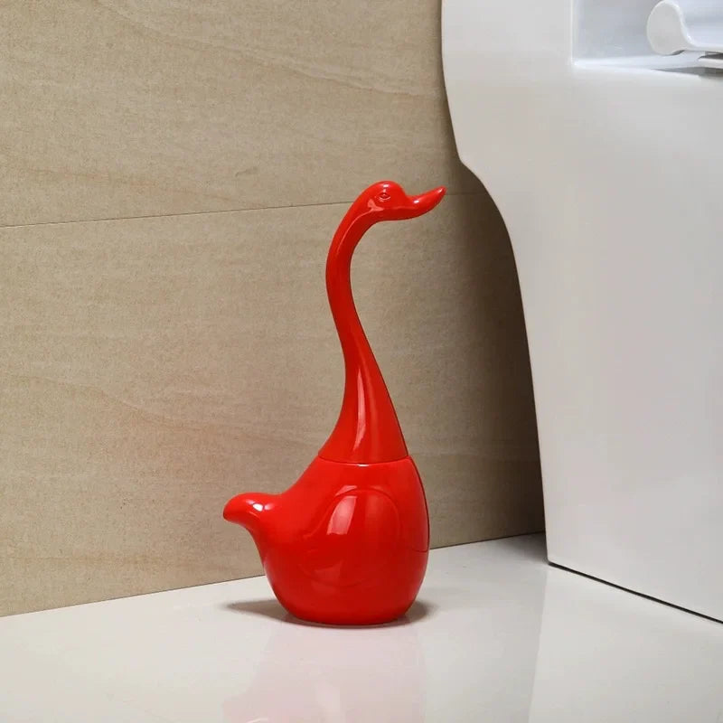 Red swan-shaped toilet brush holder with long curved neck handle – elegant bathroom cleaning accessory and decorative storage