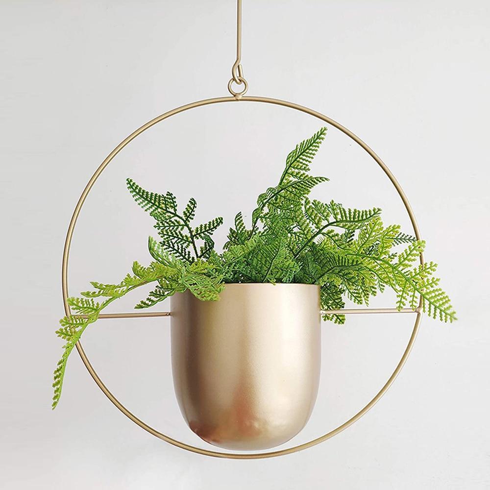 Set of modern hanging metal planters with geometric frames, indoor wall plant holders for home and balcony decor