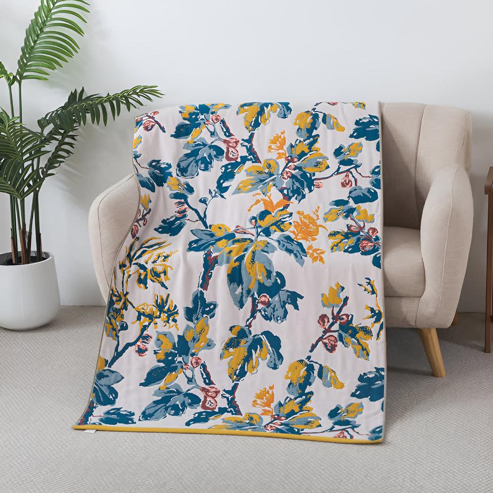 Soft decorative throw blanket with bold yellow and blue floral leaf print, lightweight cozy sofa couch cover