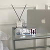 Modern LED digital alarm clock in black and white with large display, 12/24 hour format and night light feature