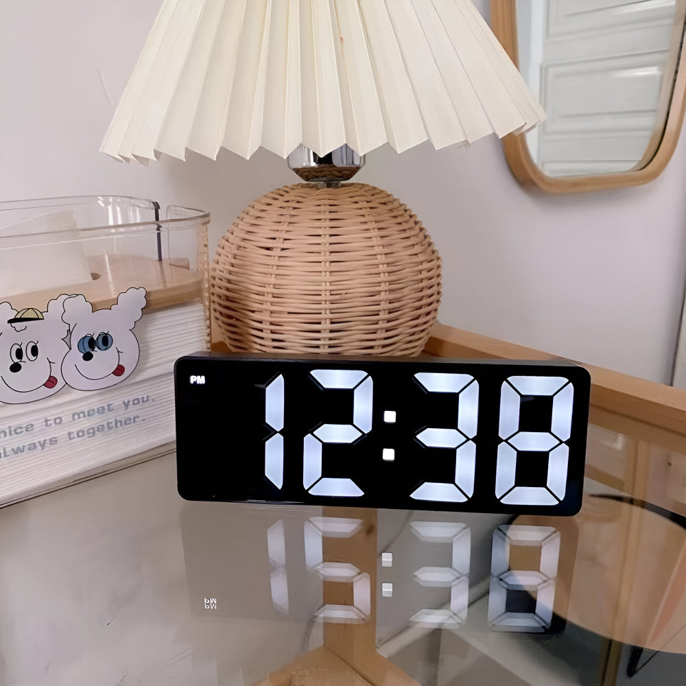 Modern LED digital alarm clock in black and white with large display, 12/24 hour format and night light feature