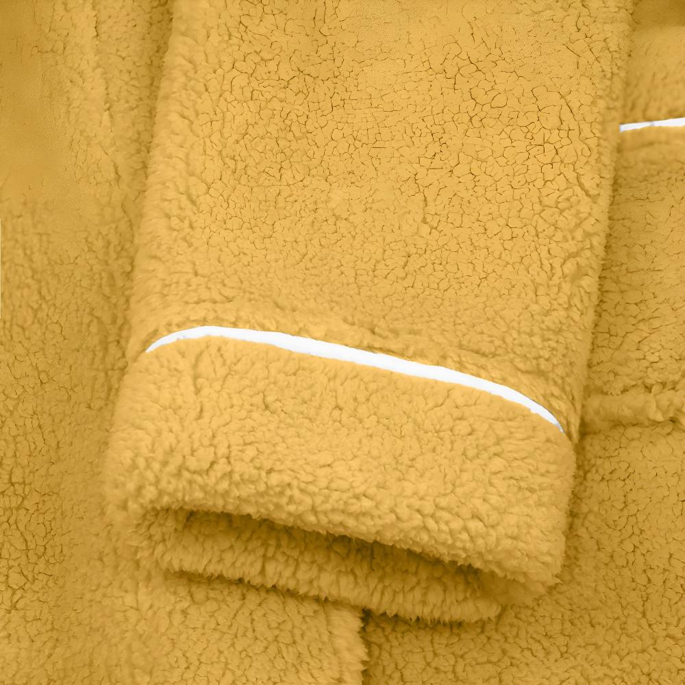 Couple wearing matching long yellow fleece bathrobes with shawl collars, front pockets, and waist belts, cozy winter loungewear