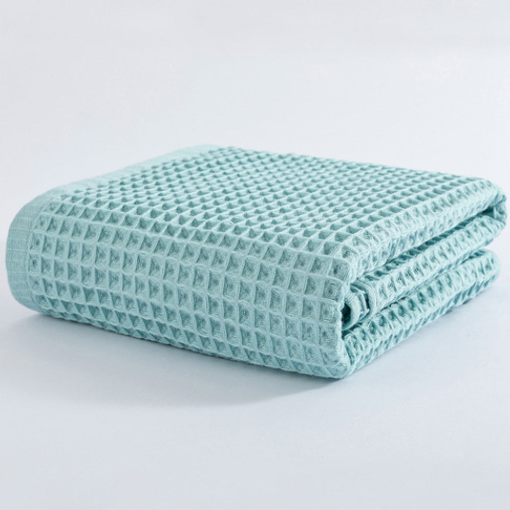 Waffle weave bath towel in pastel colors including pink, blue, white, and gray, ultra-absorbent and quick-drying