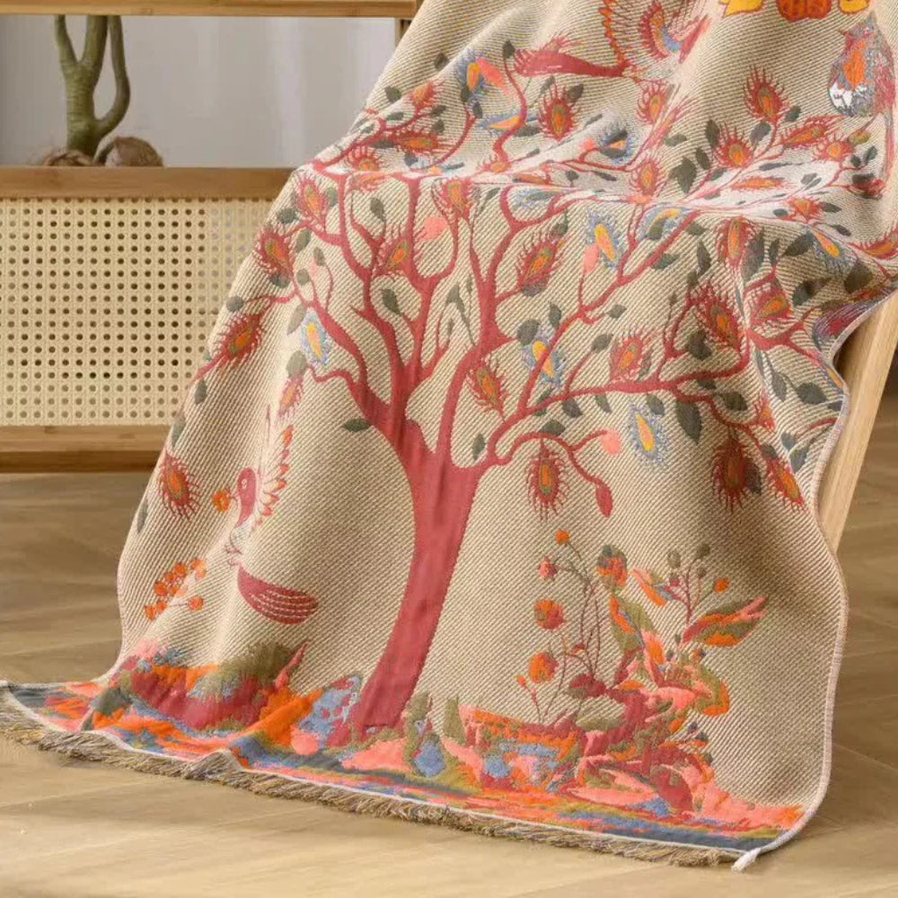 Bohemian woven throw blanket with tree and floral design in earthy tones, decorative sofa and bed cover with fringe edges