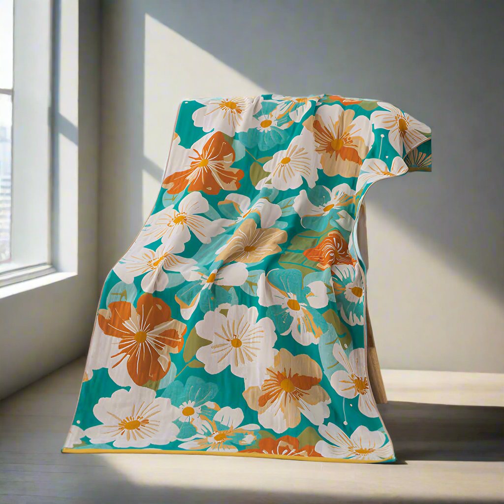 Floral throw blanket with white and orange flower design on teal background, lightweight decorative sofa and bed cover