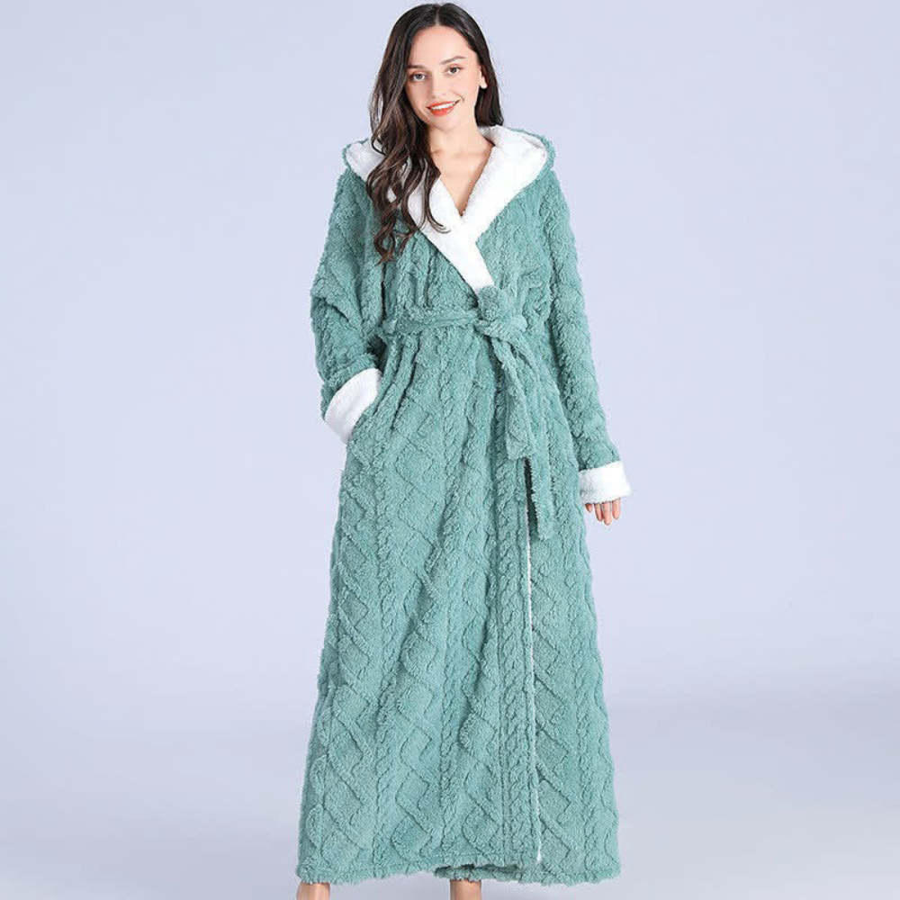 Women's long purple fleece bathrobe with hood, white trim, and textured chevron pattern, cozy winter loungewear