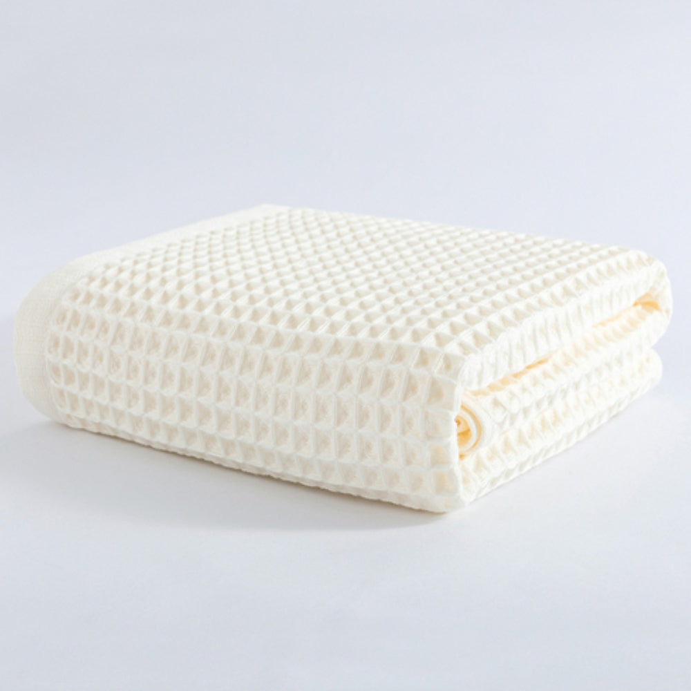 Waffle weave bath towel in pastel colors including pink, blue, white, and gray, ultra-absorbent and quick-drying