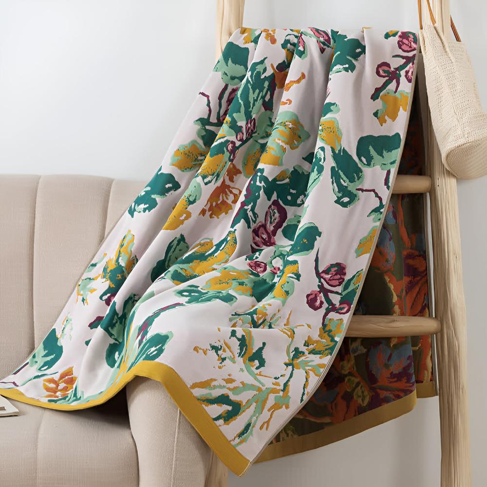 Soft decorative throw blanket with bold yellow and blue floral leaf print, lightweight cozy sofa couch cover