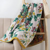 Soft decorative throw blanket with bold yellow and blue floral leaf print, lightweight cozy sofa couch cover