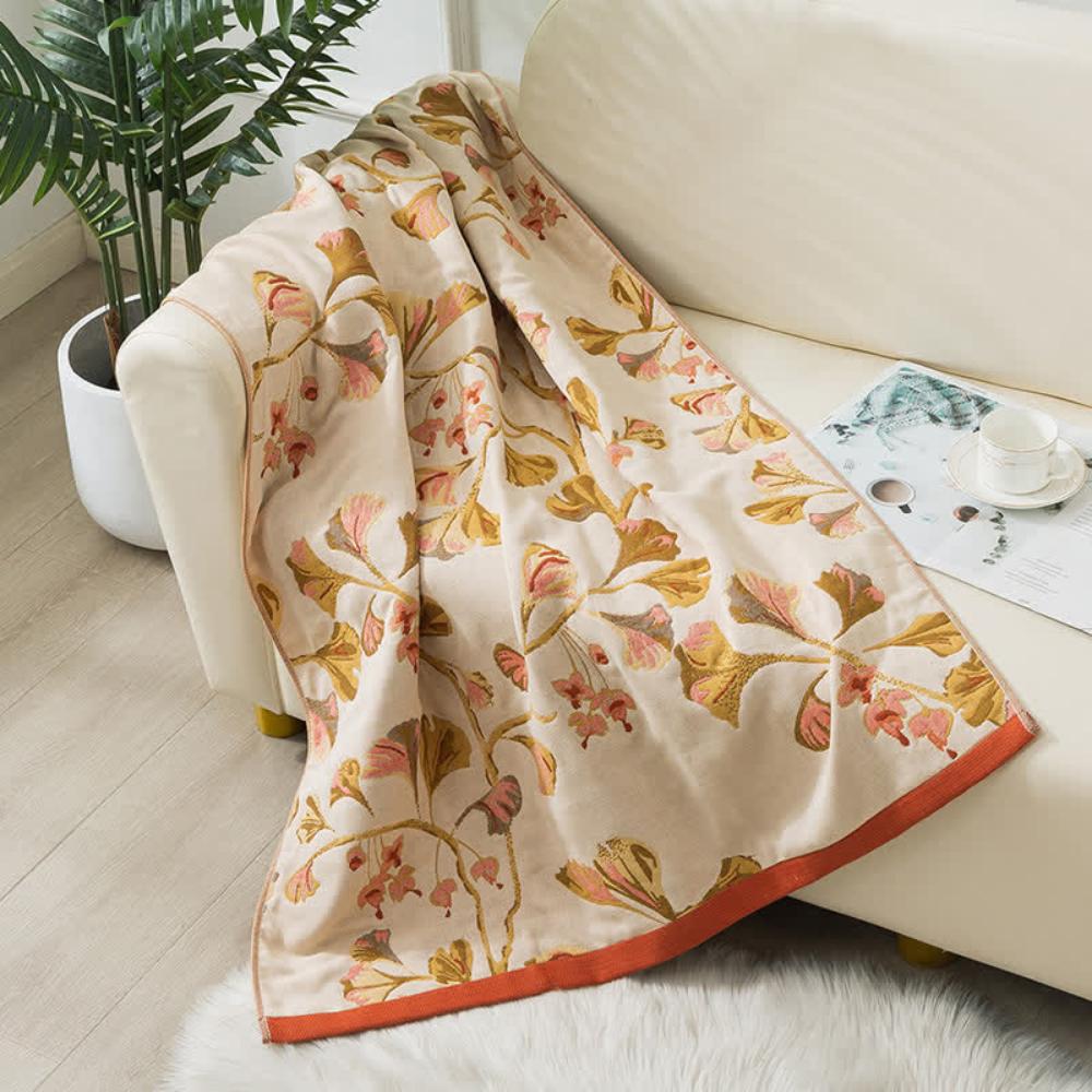 Elegant floral throw blanket with beige background and gold pink leaf design, soft decorative sofa and bed cover