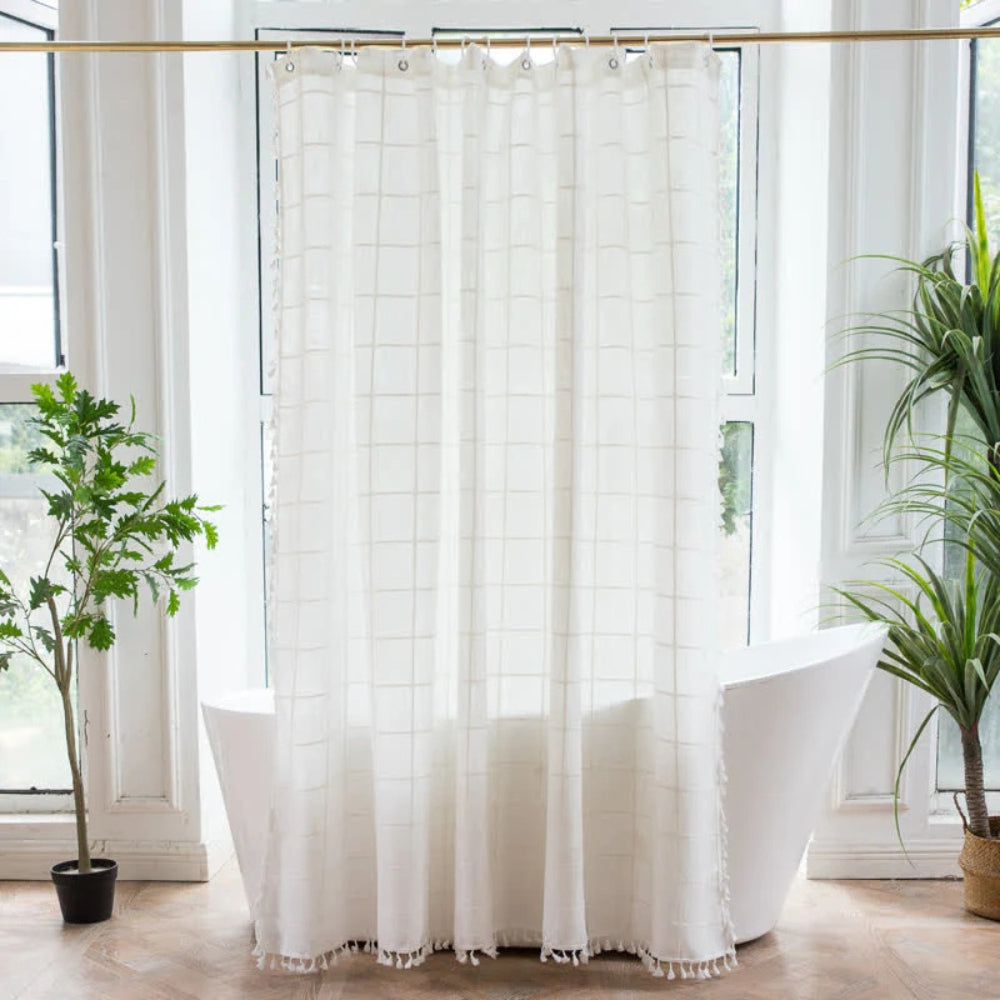 Light green sheer shower curtain with grid pattern and tassel trim, waterproof bathroom curtain for modern home decor
