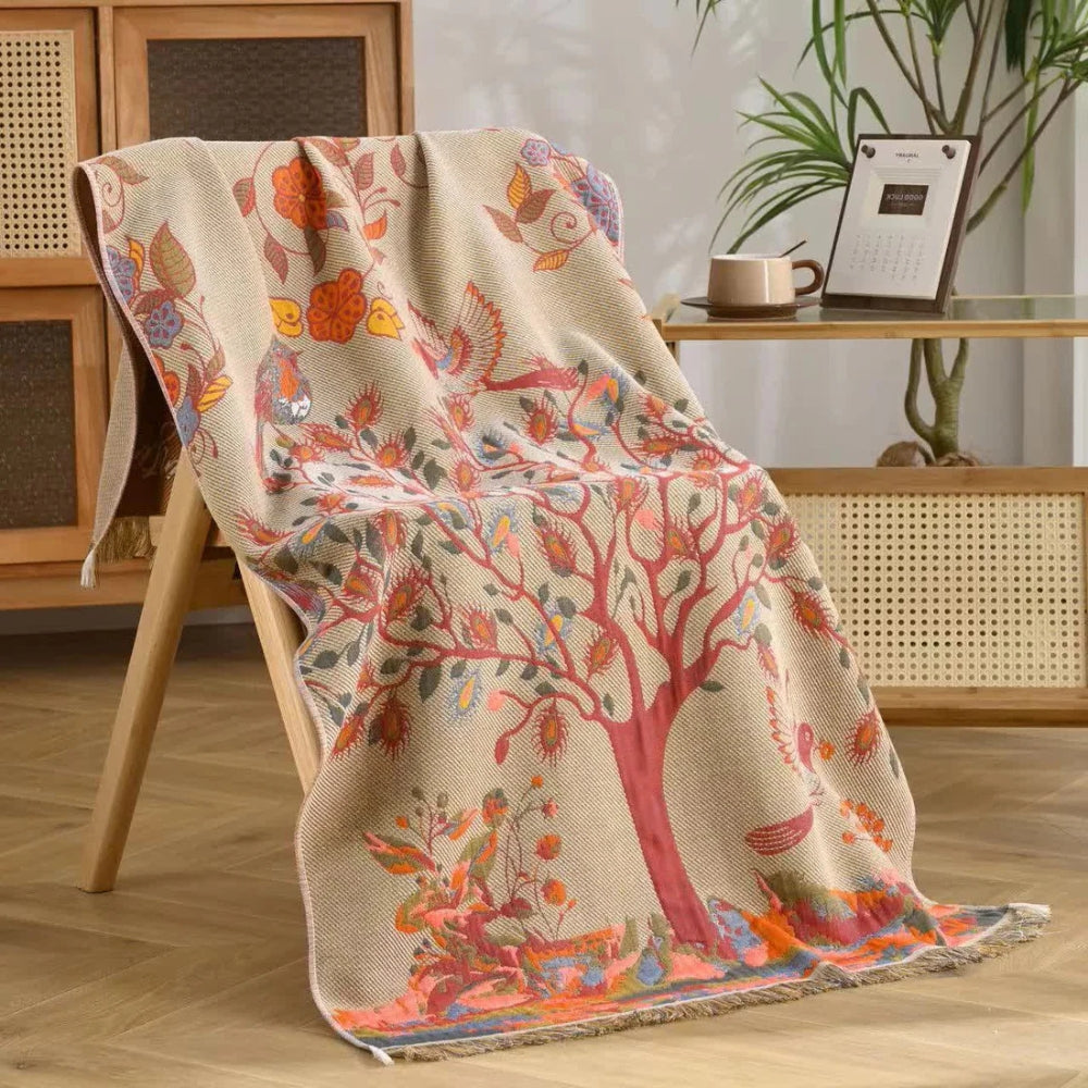 Bohemian woven throw blanket with tree and floral design in earthy tones, decorative sofa and bed cover with fringe edges