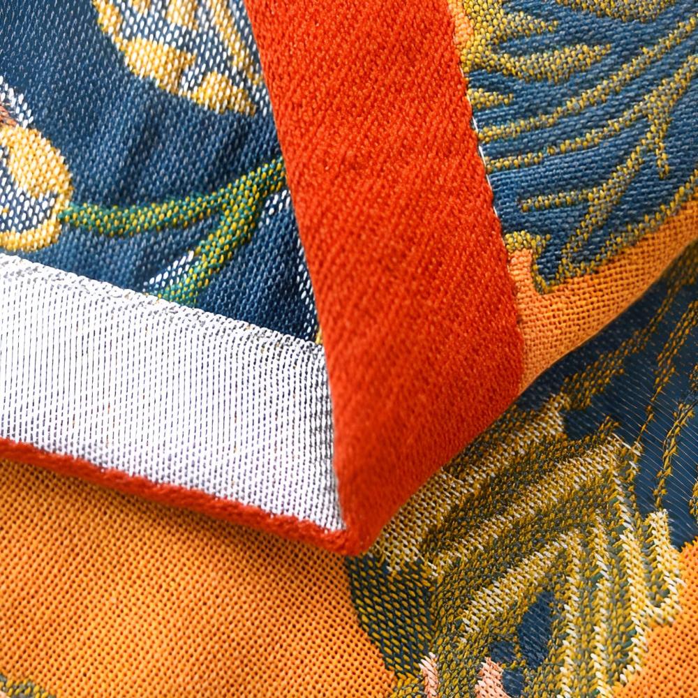 Floral throw blanket with orange background and blue yellow flower design, soft decorative sofa and bed cover