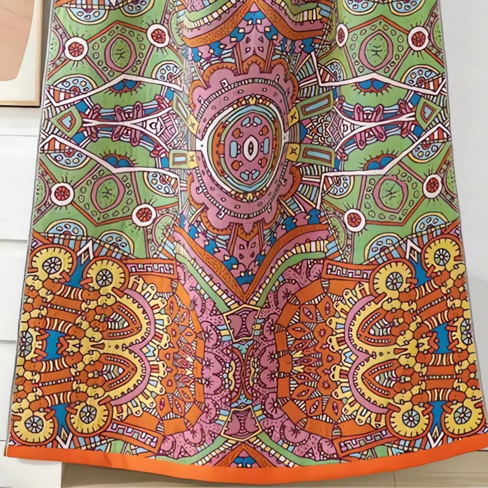 Colorful bohemian mandala throw blanket with intricate geometric and floral patterns in orange, green, pink, and yellow
