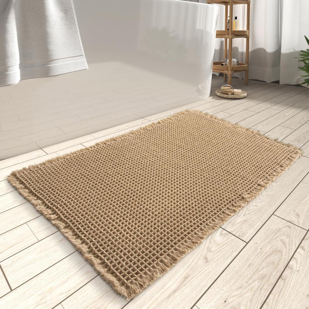 Anti-slip waffle bathroom rug in natural beige with textured weave, absorbent bath mat for shower and bathroom floor